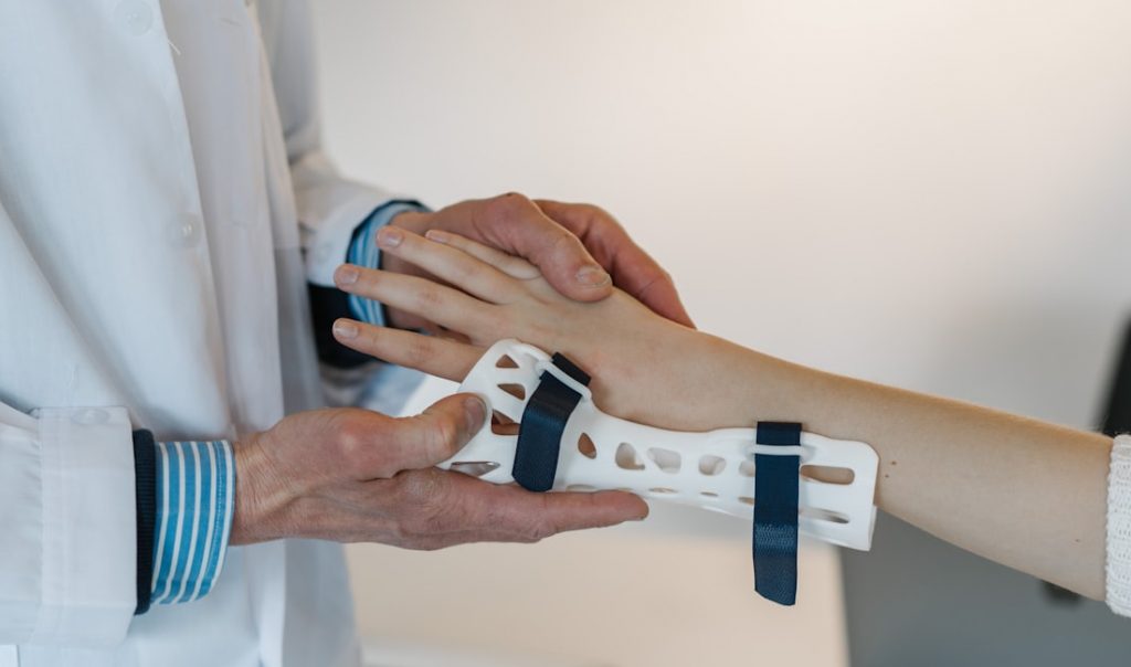 Doctor putting a cast on a patient
